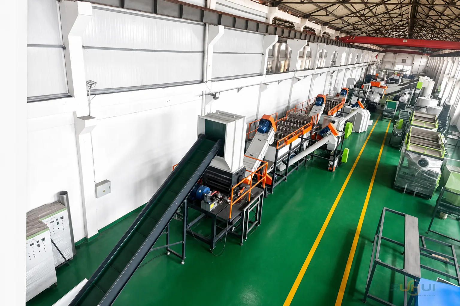 Film crusher and belt conveyor section of washing line in SUHUI factory workshop