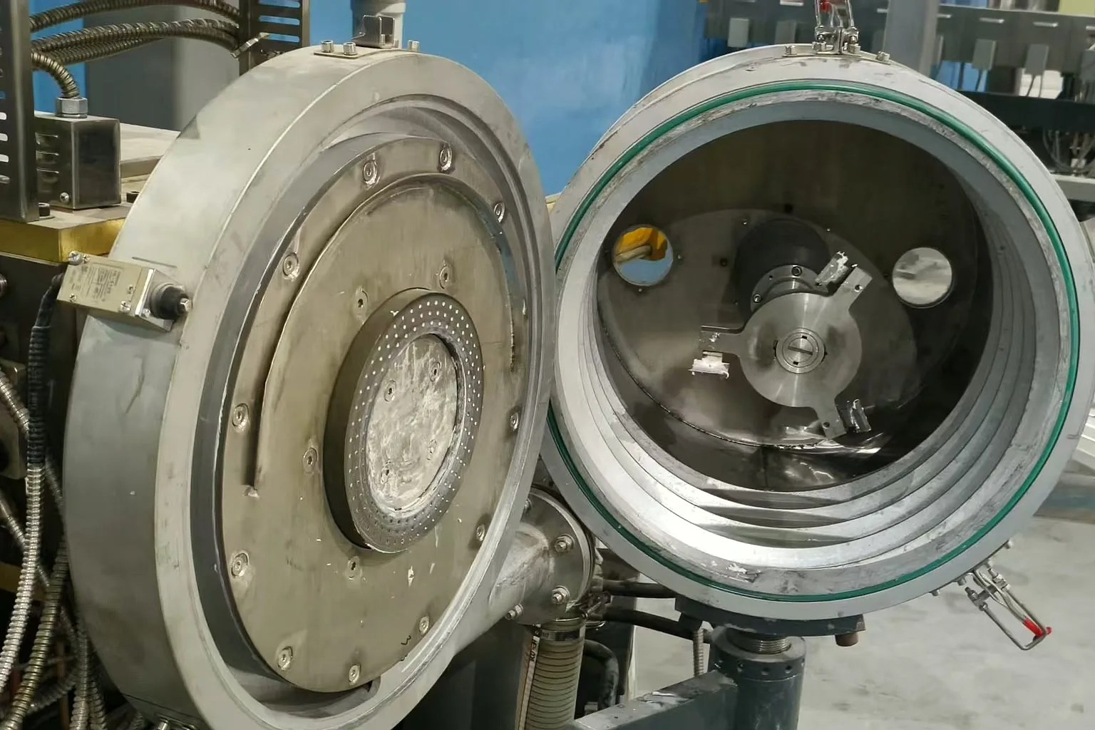 Centrifugal dryer rotor and screen detail inside rigid plastic pelletizing line at customer plant