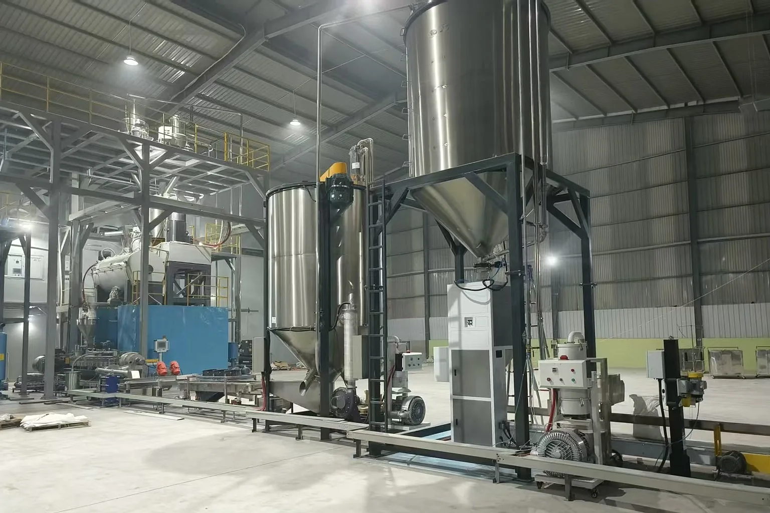 Pellet drying tower and conveying pipework at customer rigid plastic recycling plant